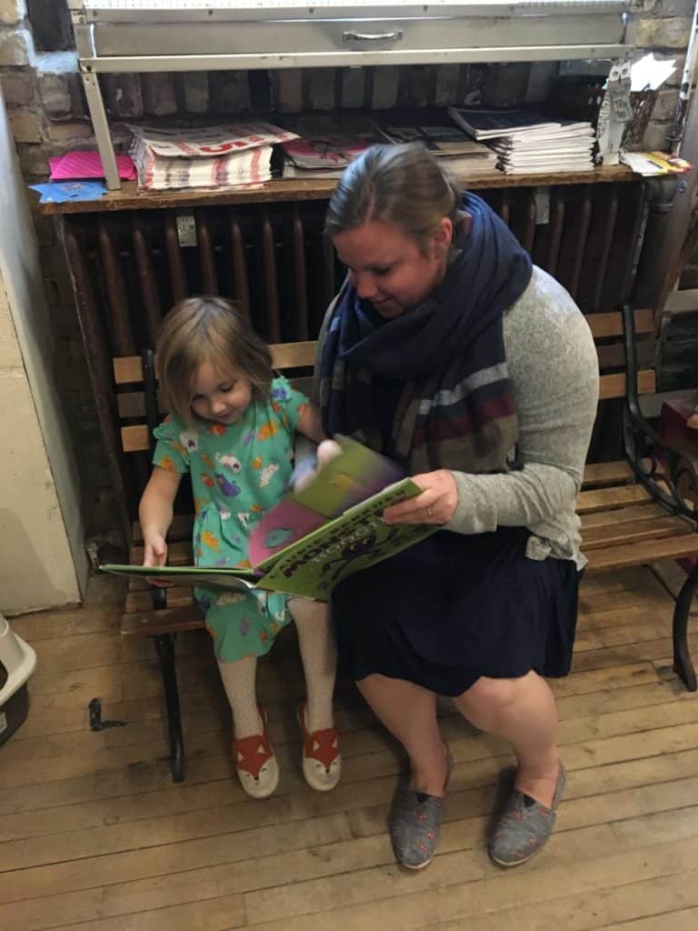 A mom and her young daughter look at books at the Wild Rumpus book shop in Minneapolis.