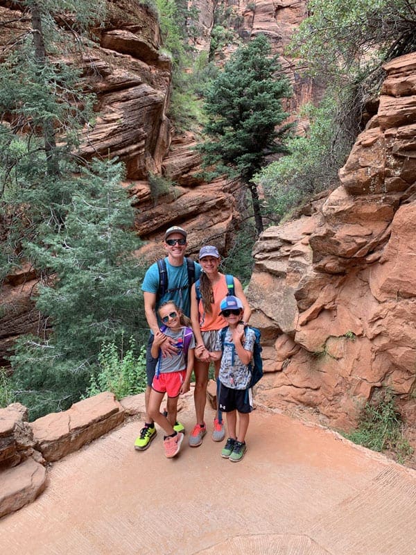 Family posing for picture while hiking in National Park