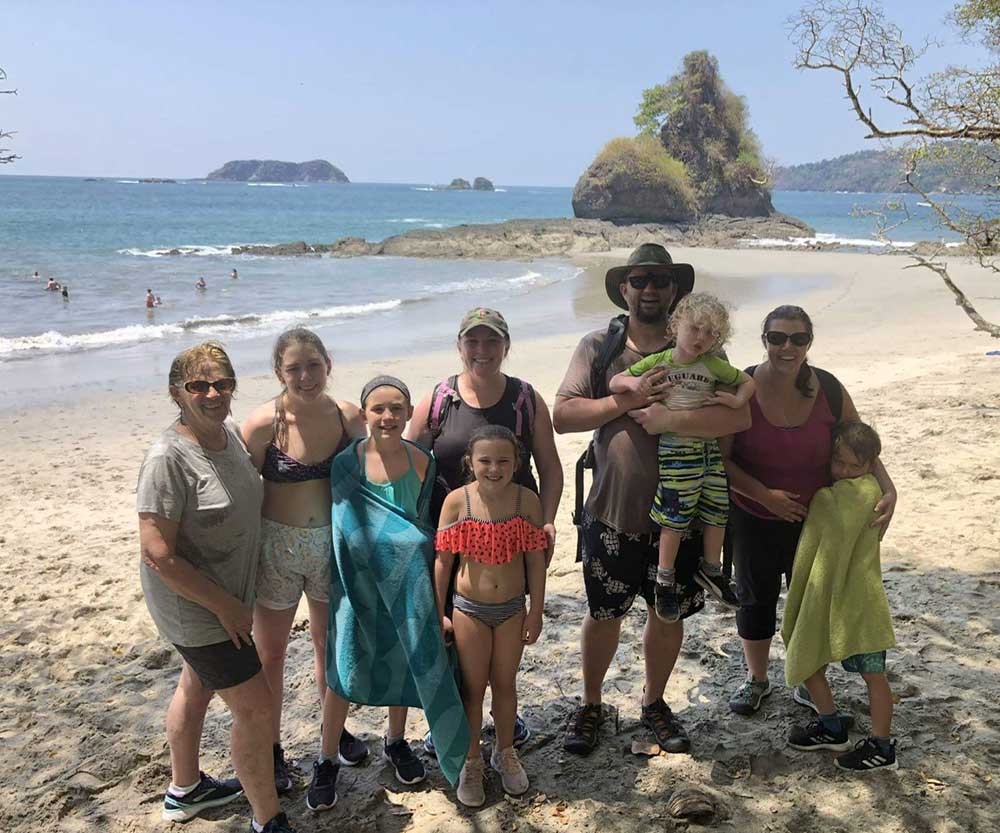 A multi-generational family on a beach in Costa Rica. 