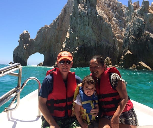 Parents with child son on boat in Cabo