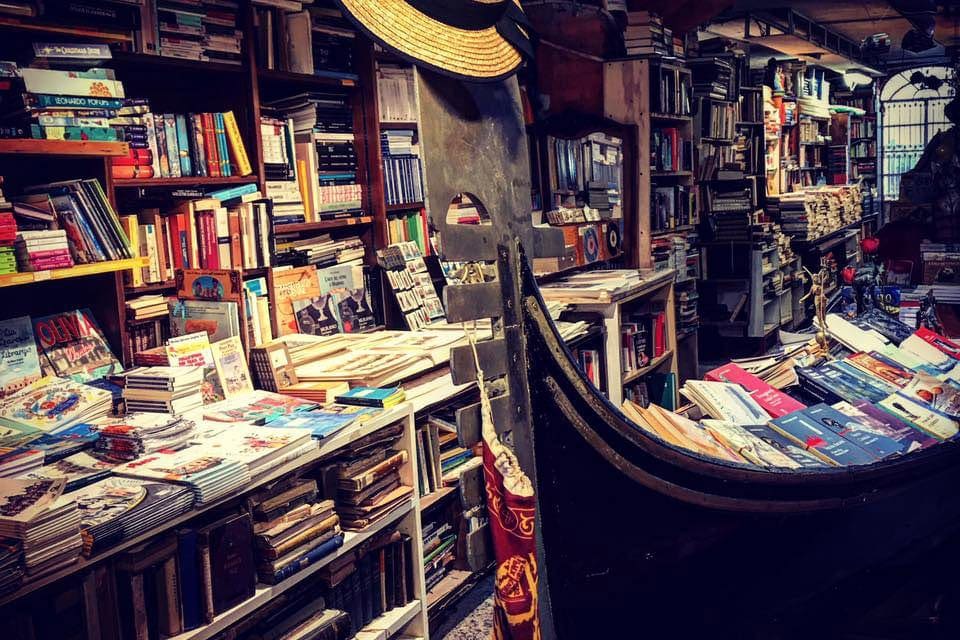 The Acqua Alta Bookshop in Venice, one of the best places to visit on an Italy Itinerary with kids. 