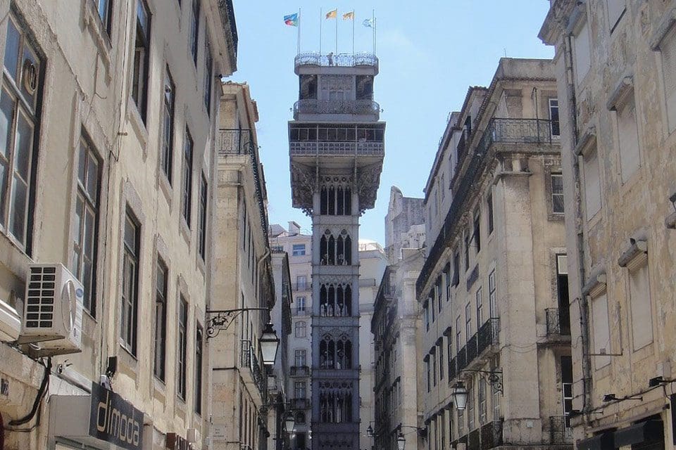 A view of Santa Justa Elevator through Lisbon's city streets.