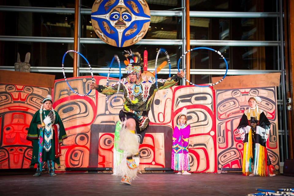 An indigenous Canadian dances inside the Squamish Lil’wat Cultural Centre.