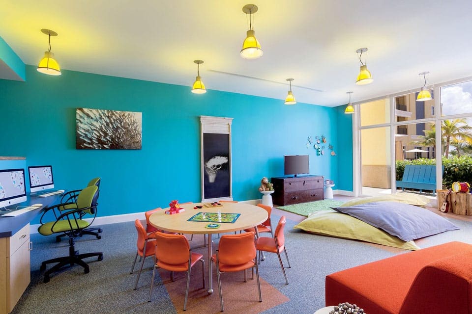 Inside the brightly colored kids' club at The Ritz-Carlton, Aruba, featuring fun furniture for kids.