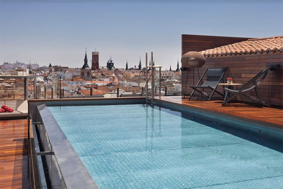 The rooftop pool at Gran Meliá® Madrid, overlooking the city.