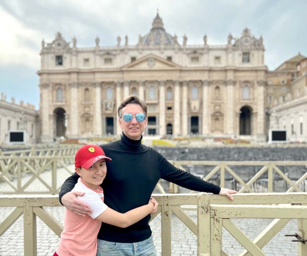 Father and son in front of Vatican in Rome Italy, one of the best places to visit during Easter with your family.