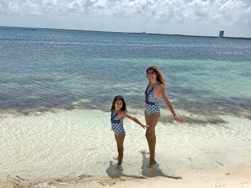 A girl and her mom enjoy a day at the beach in Cacun.