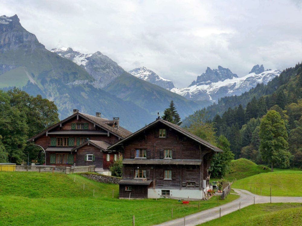 Cute house in Luzerne, with mountains in the background.