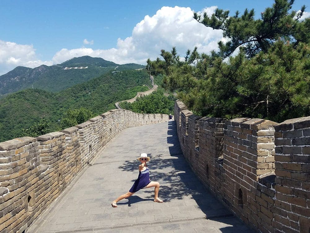 A child posing on the Great Wall of China. 