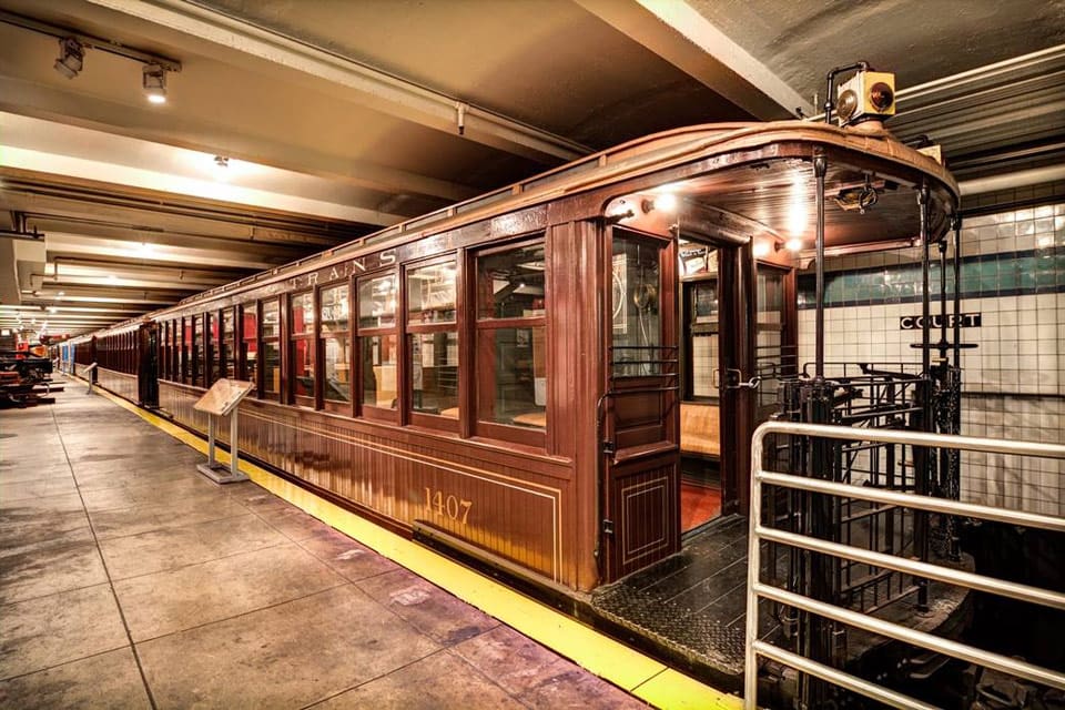 A train pulls into station at the New York Transit Museum, one of the best indoor activities in New York City for kids.