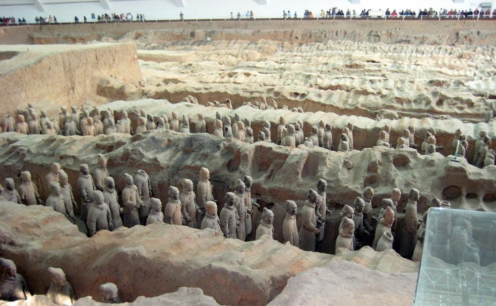 An expansive view of the pit that holds the Terracotta Warriors. Dozens can be see dotting the picture. Learning about the Terracotta Wariors is an important part of our virtual vacation to China.