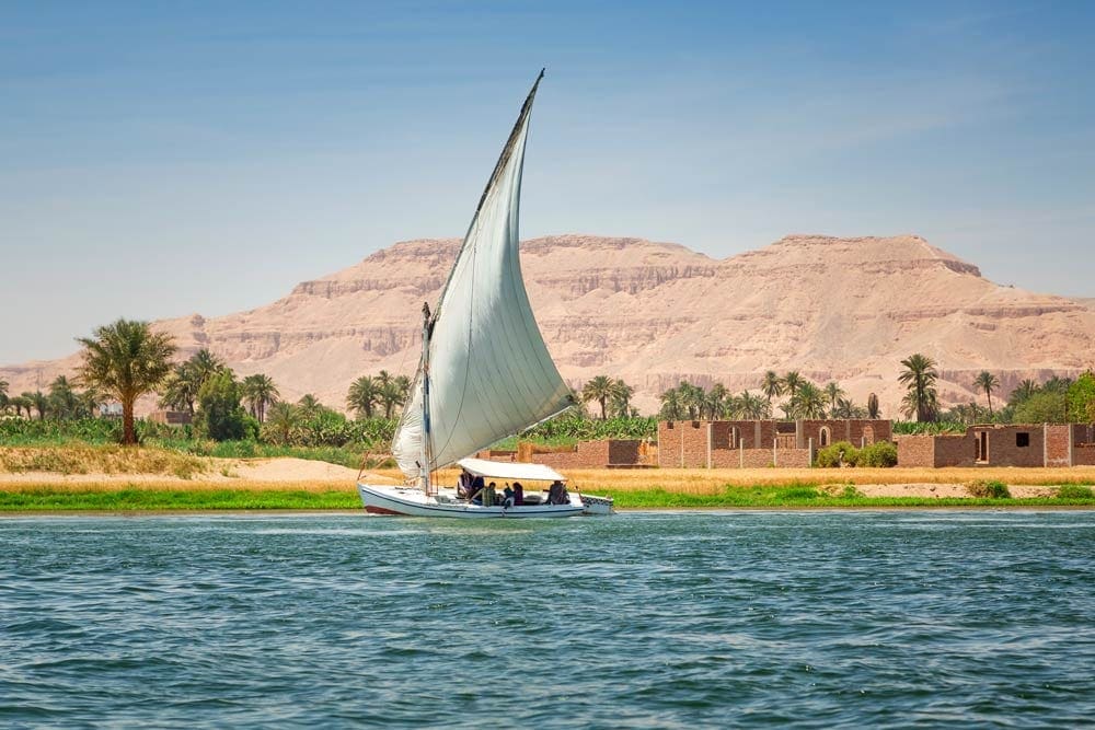 Sail boat on river Nile Egypt, one of our stops as we take a virtual vacation to Luxor.
