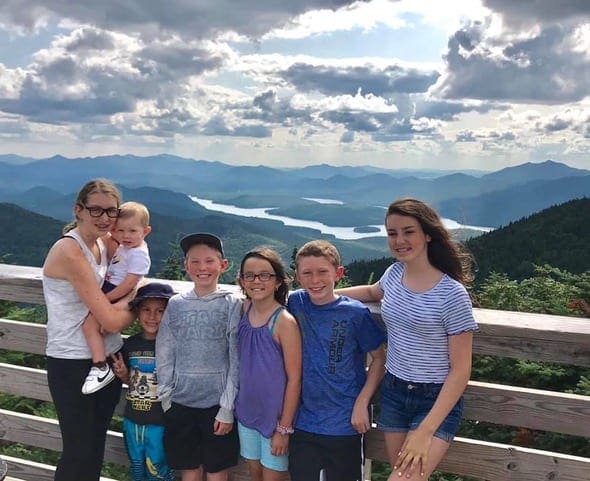 Group of kids posing for picture on top of mountain in upstate New York