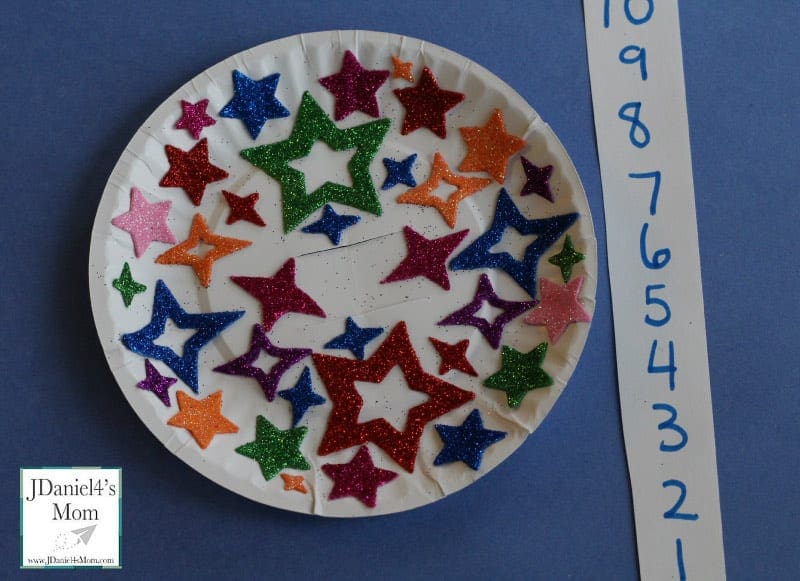 Ball Drop art featuring numerous stars on a paper plate with a countdown starting at 10.