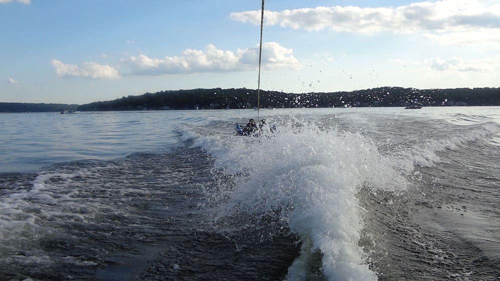 People water skiing in Lake Hopatcong in New Jersey, one of the best lakes for a family vacation within 4 hours of NYC.