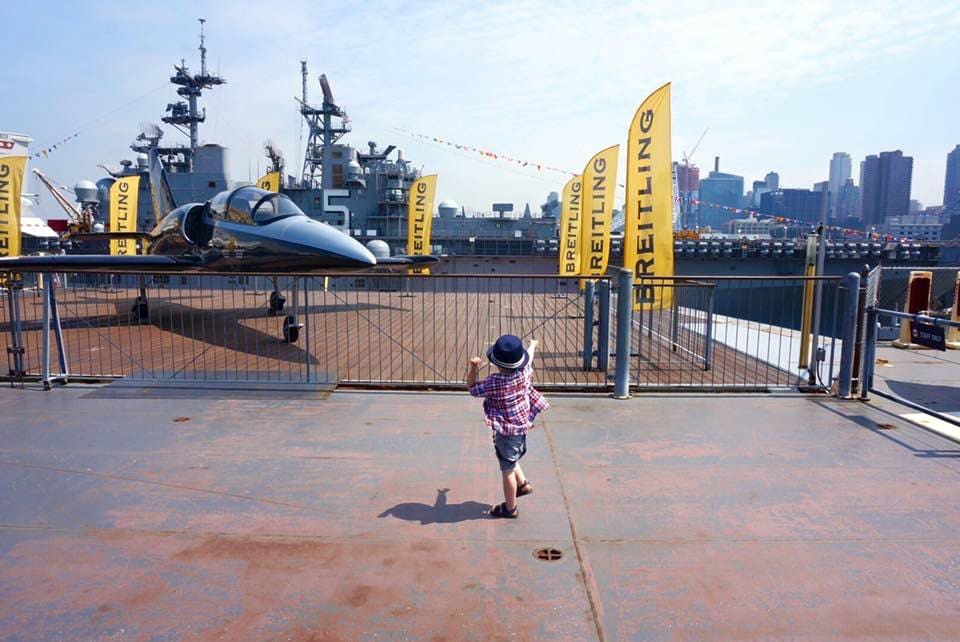 Little boy looking at planes on the Intrepid in NYC