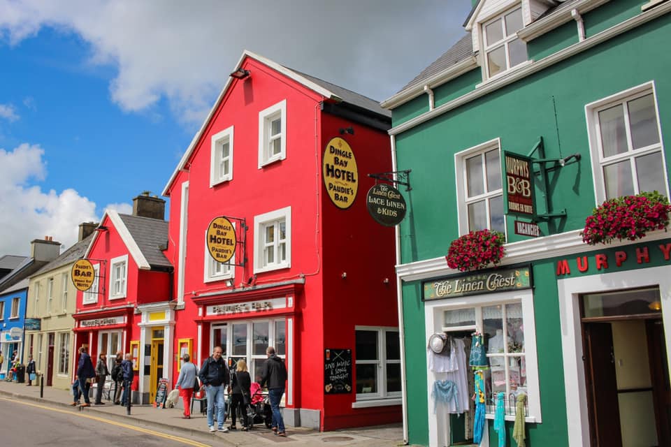 View of a several colorful shops along a street in Dingle, Ireland, one of the best colorful towns for families. 