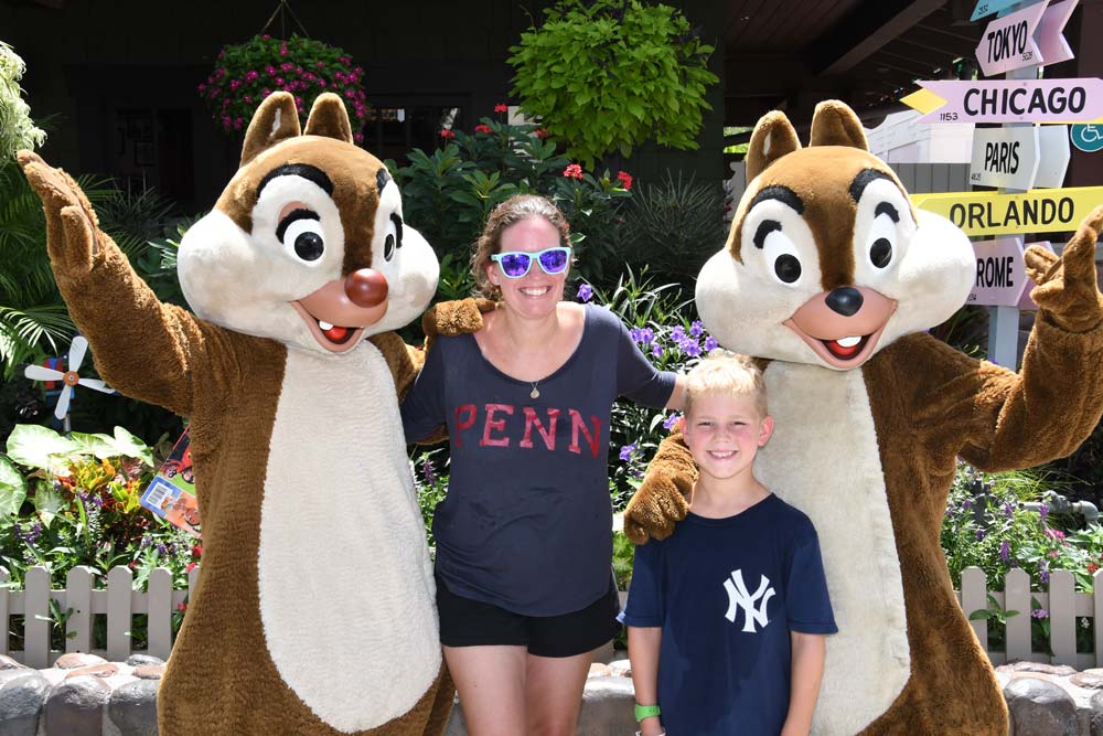 Mother and son posing with chipmunk characters at Disney World