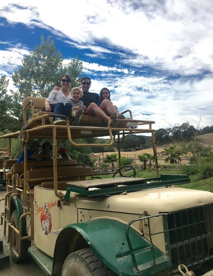 Family sitting on top of Safari jeep
