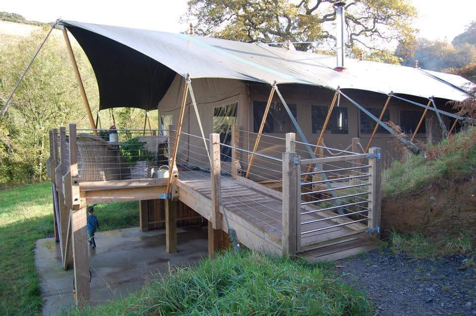 A view of a luxury tent situated in Devon, United Kingdom, Your Guide To Family Glamping in Style.