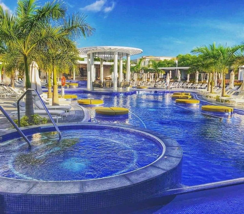 A stunning view of the Unique Day Club, an adult only pool at the Grand at Moon Palace Hotel in Cancun, one of the best resorts in Mexico for families.