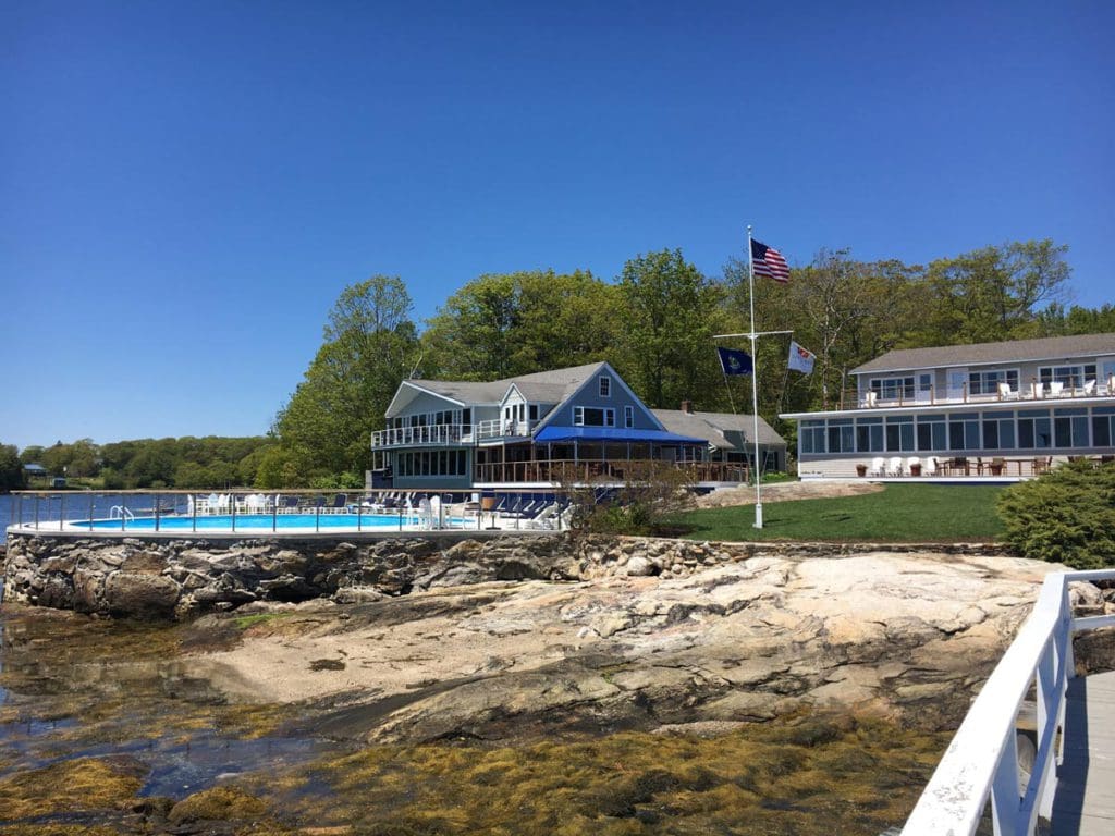 A walkway along the rocky shoreline of Linekin Bay Resort, heading toward the resort buildings, one of the best Maine hotels for families.