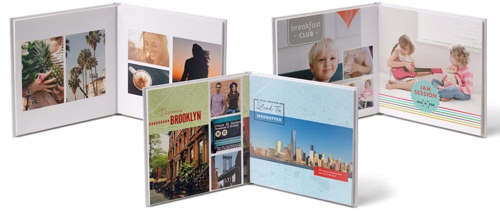 Three open family photo books featuring styles by Snapfish, one of the best family travel gifts of the year.