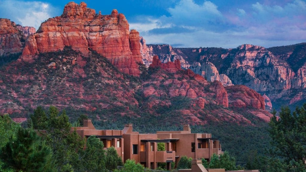 A view of Hyatt Residence Club Sedona, Piñon Pointe, with Sedona's iconic red rocks in the background, one of the best hotels in Sedona for families.