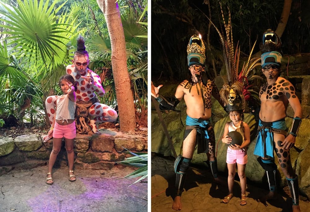 Left Image: A young girl stands with a performer in leopard print at Xcaret Eco Park. Right Image: A young girl stands with two performers at Xcaret Eco Park.