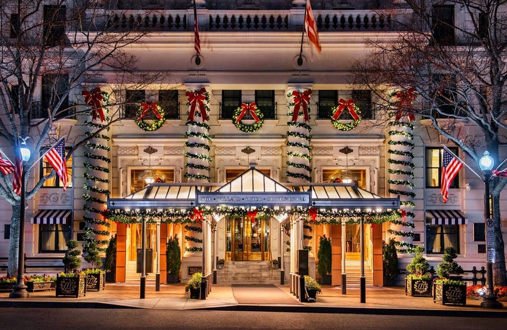The stately Willard InterContinental Washington, one of the best family hotels in Washington D.C., at Christmas is outfitted with ribbon and wreaths.