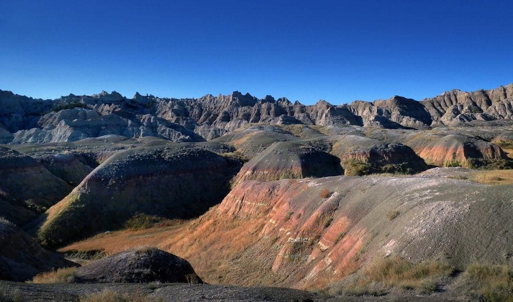 A view of jagged rock formations at the Badlands National Park, a beautiful sight on your Family-Friendly Itinerary to the Badlands.