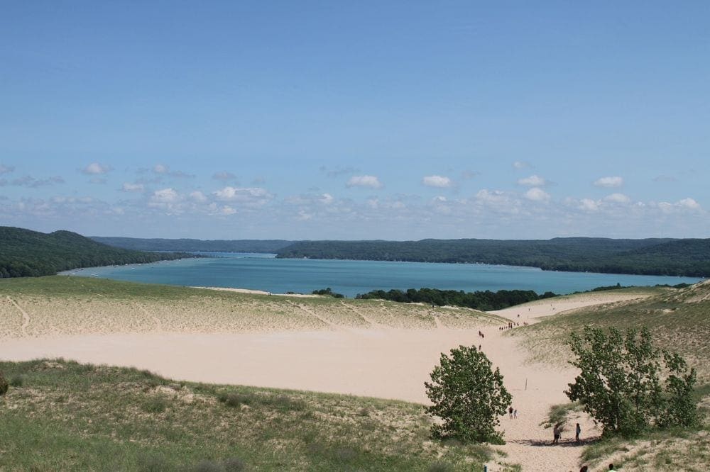 A view of the beach and water at Sleeping Bear Dunes in Michigan, one of our recommended kid-friendly U.S. beaches for families.