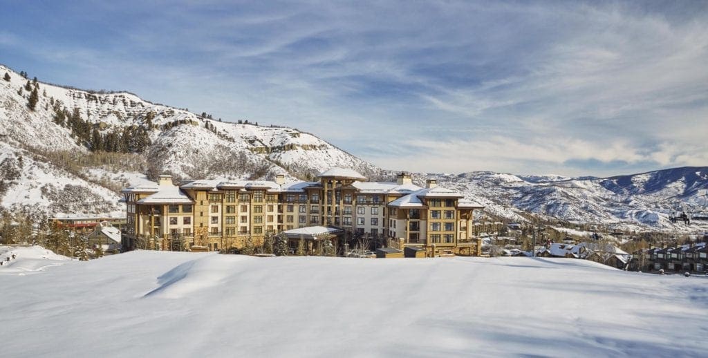 The Viceroy Snowmass Luxury Hotel & Resort on a sunny, snowy day.