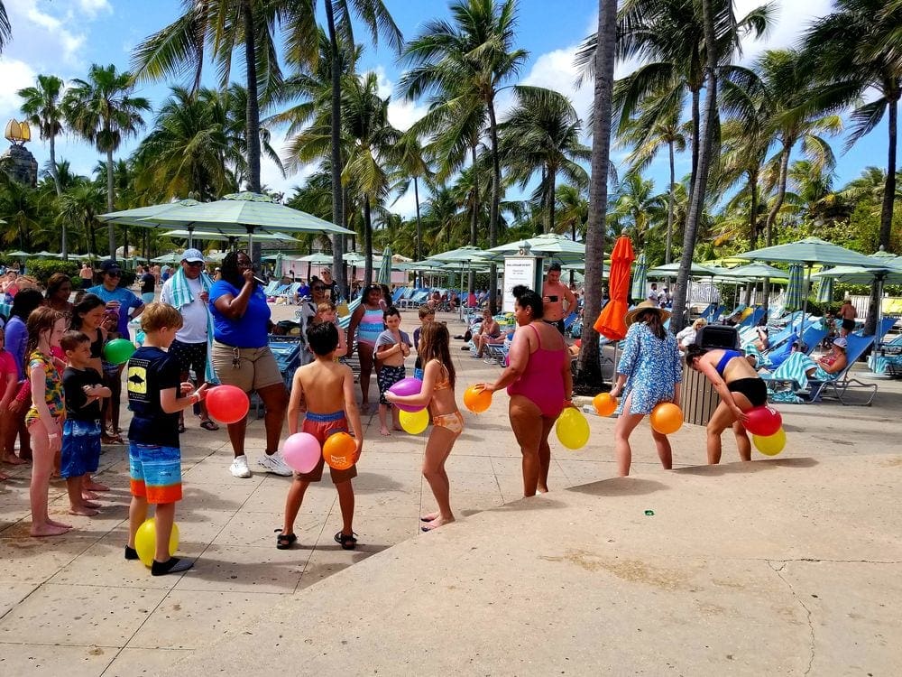Several kids enjoy a balloon game on the grounds of Atlantis Bahamas.