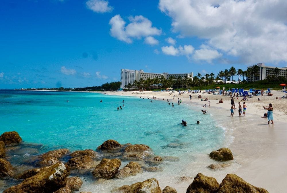 A stretch of beach, featuring clear blue waters along the shore of Atlantis Bahamas.
