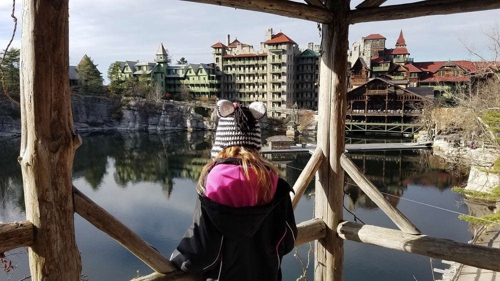 A young girl looks on over the water at the Mohonk Mountain Resort.
