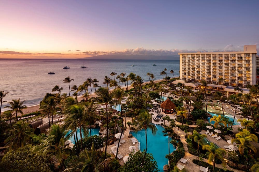An aerial view of The Westin Maui Resort & Spa, Ka’anapali at sunset, featuring lush grounds and tall resort buildings.