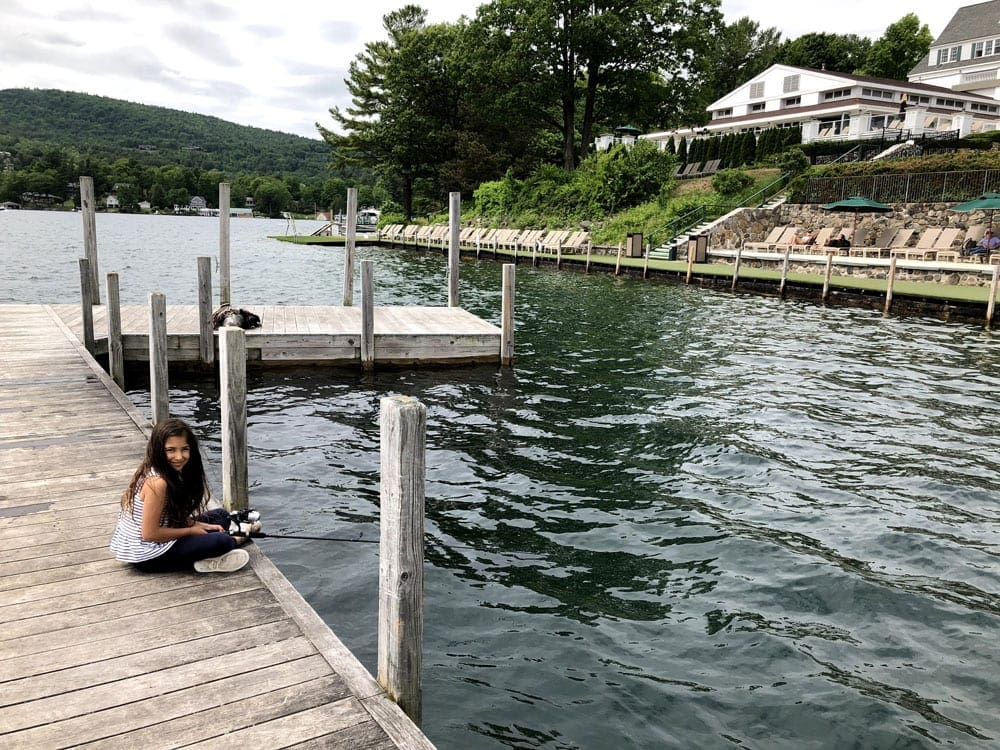 A young girl fishes off the dock while staying at the The Sagamore Resort.