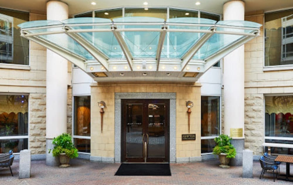 The elegant entrance to the Kimpton Marlowe Hotel during the day.