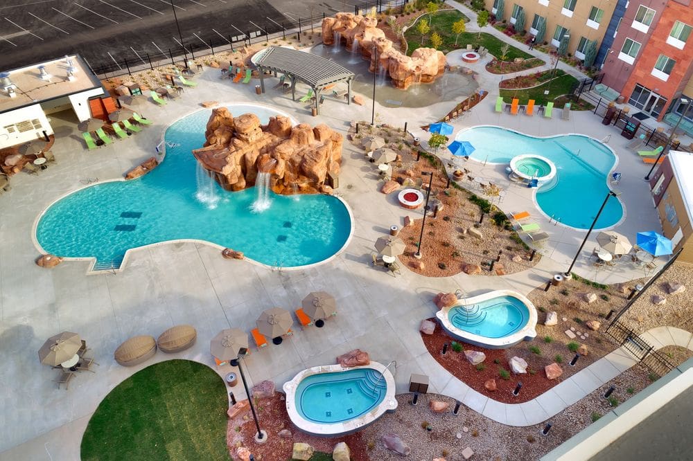 An aerial view of the outdoor pools and hot tubs at the SpringHill Suites by Marriott Moab, one of the options for hotels in Moab for families.