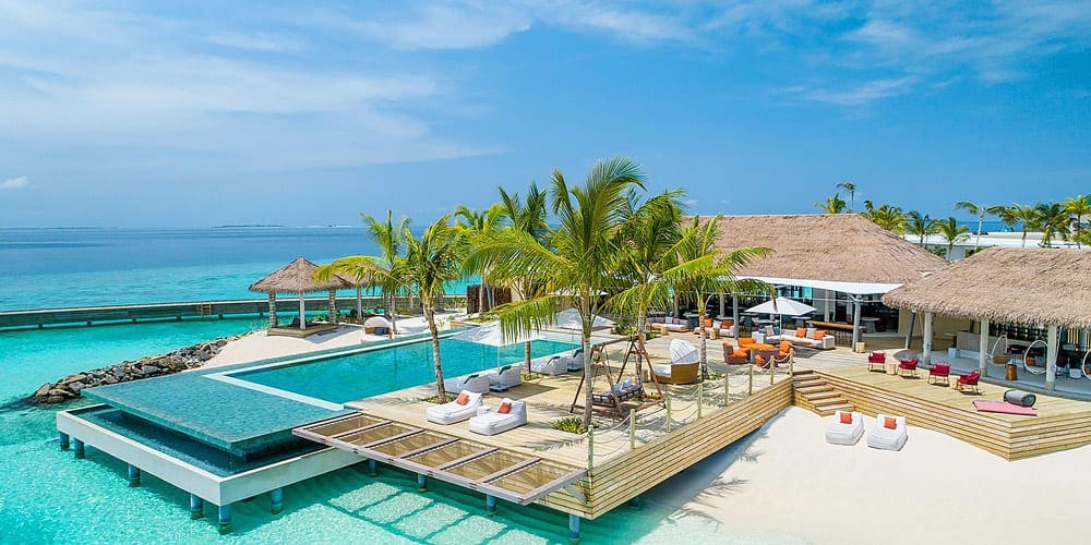 One of the many pools on a sunny day at the InterContinental Maldives Maamunagau Resort, one of the best family hotels in the Maldives.