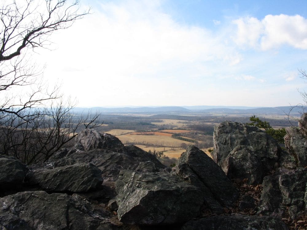 An overlook onto a scenic view of Maryland from Sugarloaf Mountain, one of the best hikes near DC for families.