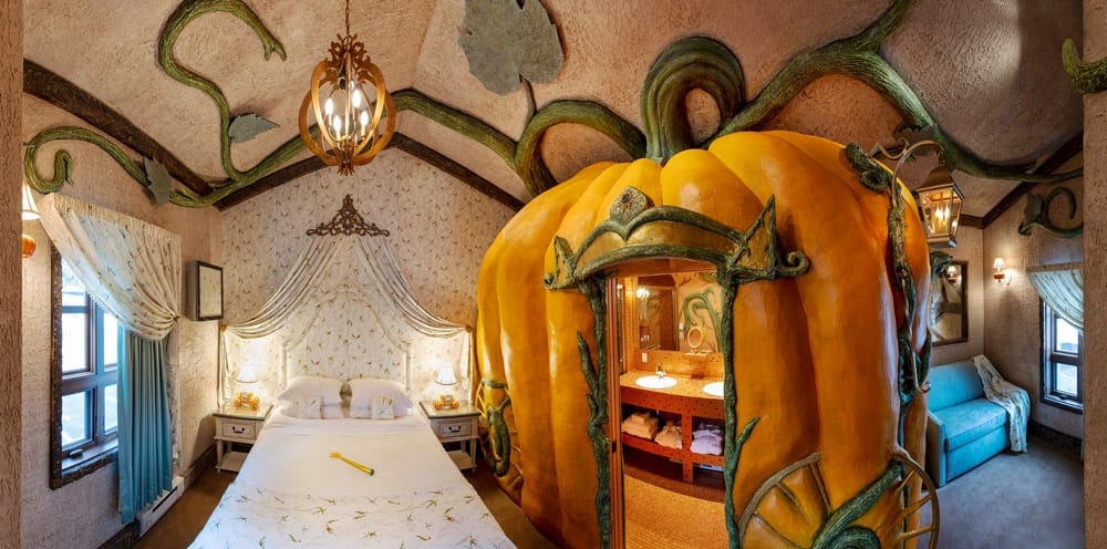 Inside one of the princess rooms, featuring a Cinderella theme with a large pumpkin at the The Roxbury Experience.