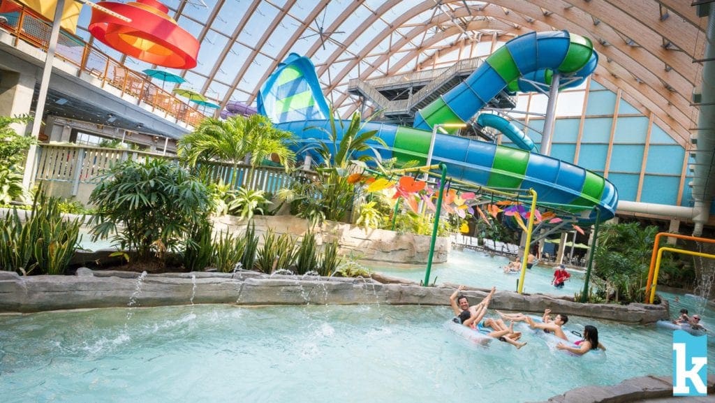 A family floats down the lazy river within the indoor waterpark at the The Kartrite Resort and Indoor Water Park.