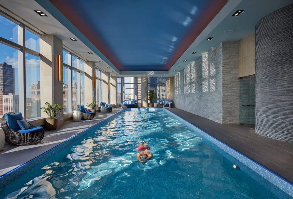 A lone swimmer enjoys the indoor pool at the The Mandarin Oriental, New York.