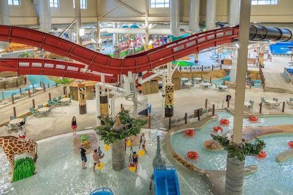 An aerial view of the indoor water park, featuring several splash areas and a lazy river, at Kalahari Resort Poconos Mountains.