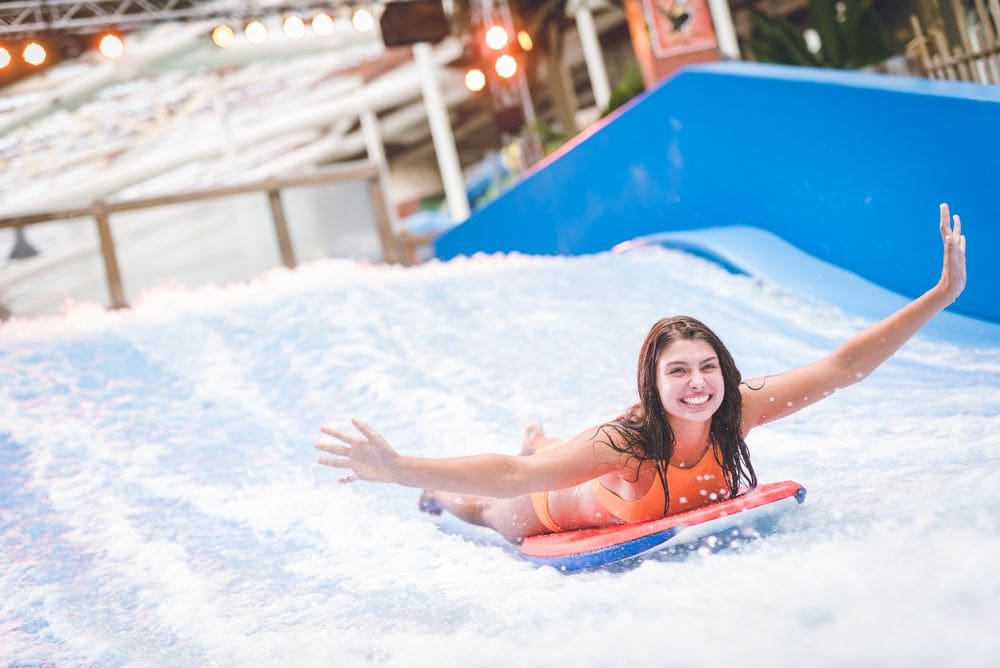 A woman zooms down Flo Rider at the Kartrite Resort and Indoor Water Park.