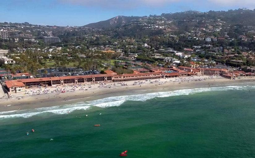 An aerial view of La Jolla Beach and Tennis Club, with its sprawling beachfront, one of the best San Diego beachfront hotels for families.