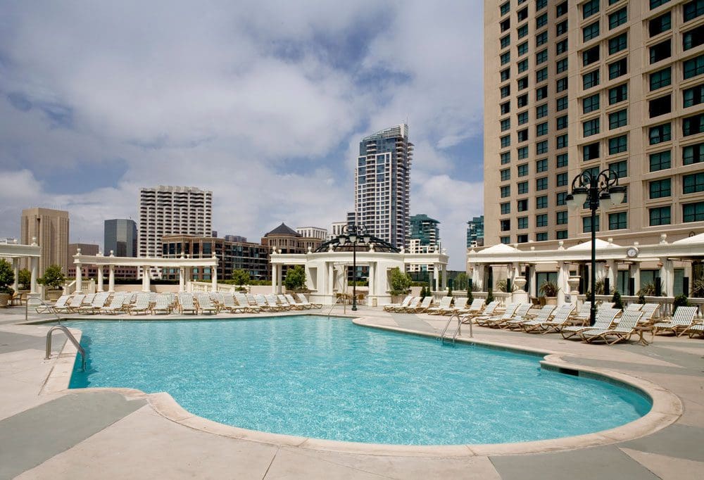 The pool at the Manchester Grand Hyatt San Diego, with the hotel towering in the background.