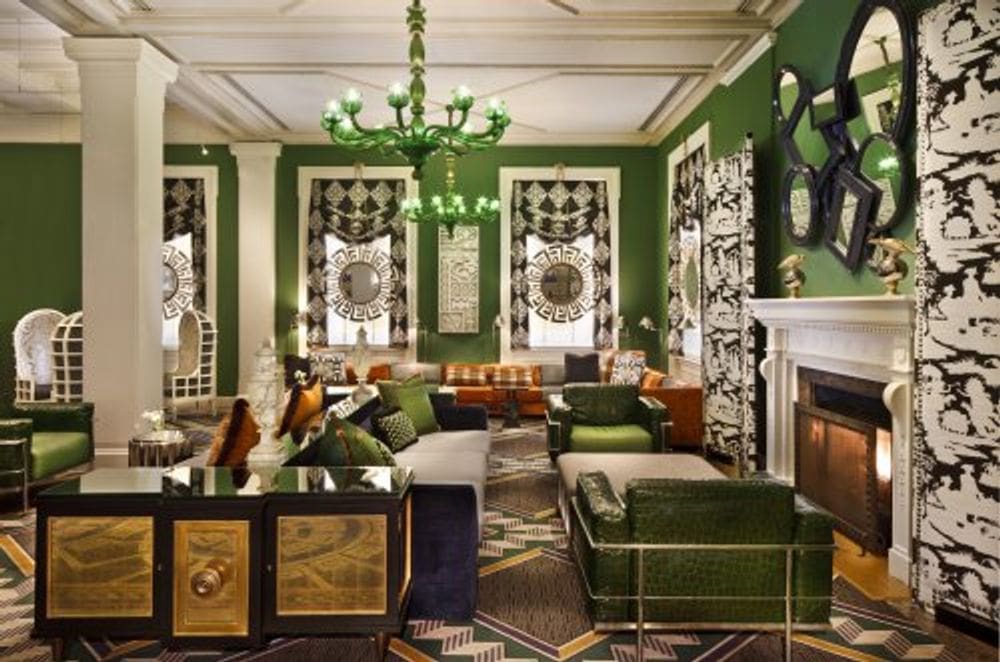 The brightly lit lobby, with green accents, at the Kimpton Hotel Monaco Washington DC.